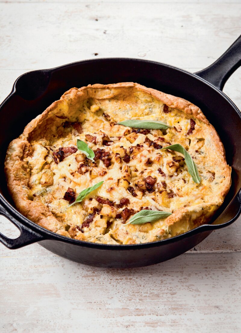 A cast-iron skillet with a savoury Dutch Pancake